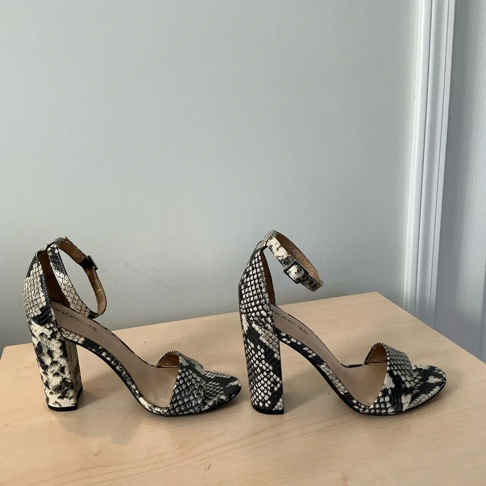 Francesca’s snake print embossed ankle strap heels